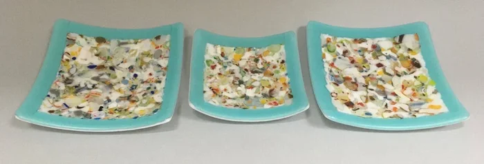 Three Confetti Plates on Blue