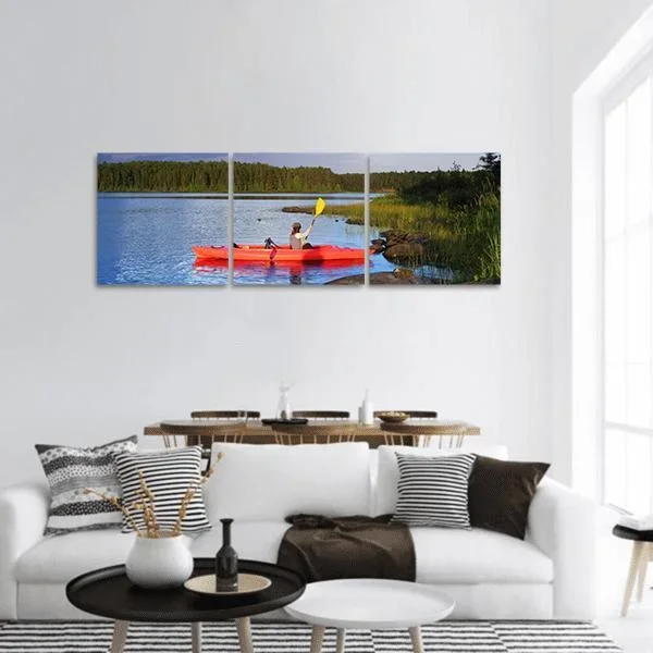Woman Canoeing In A Lake Panoramic Canvas Wall Art